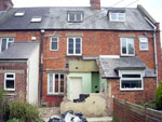 Work being carried out at the back of a terraced house